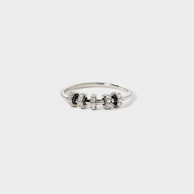 a silver ring with three stones on it