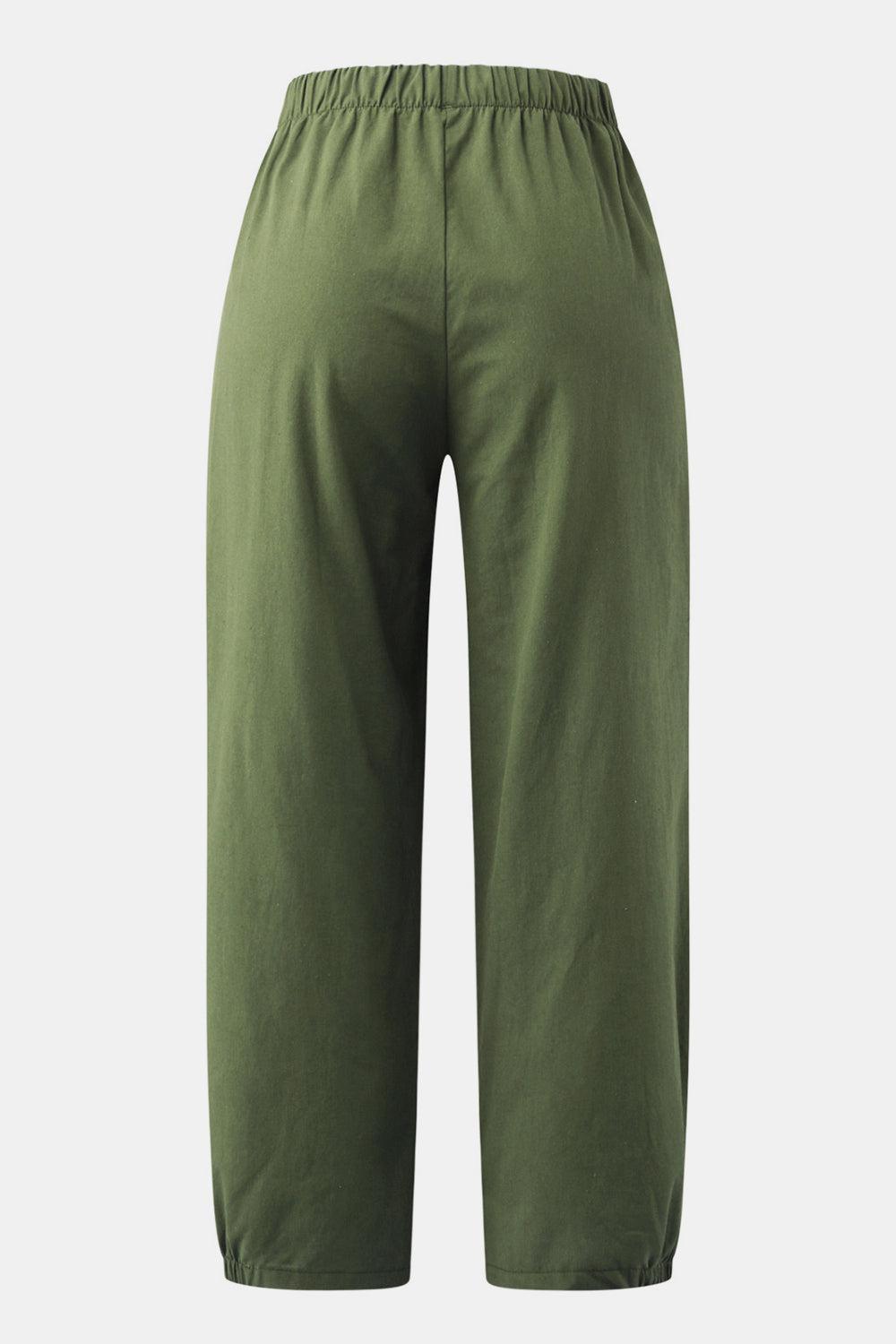 a close up of a person wearing green pants