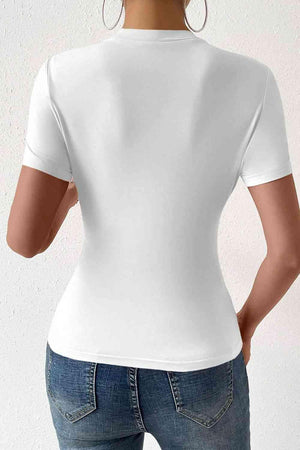 a woman wearing a white shirt and jeans