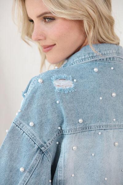 a woman with blonde hair wearing a denim jacket