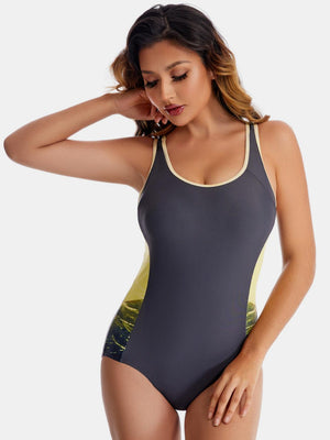 a woman in a gray and yellow swimsuit