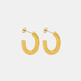 a pair of gold hoop earrings on a white background