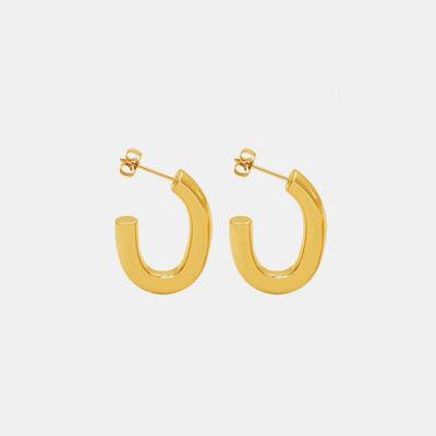 a pair of gold hoop earrings on a white background