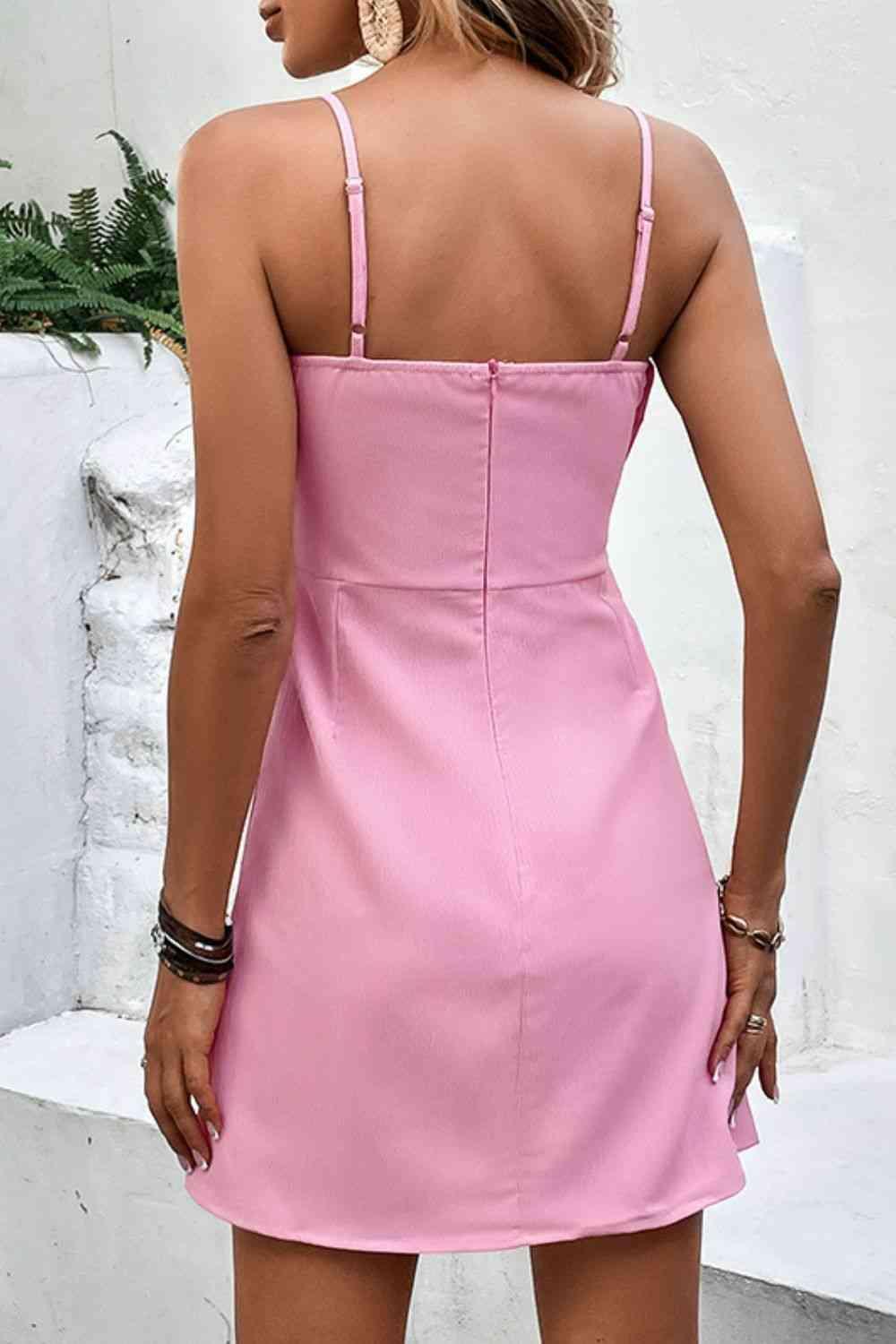 a woman in a pink dress looking back