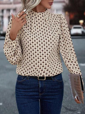 a woman wearing a hat and a blouse