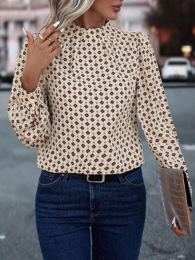 a woman wearing a hat and a blouse