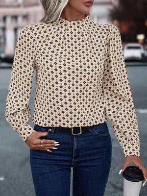 a woman standing on a street holding a coffee cup