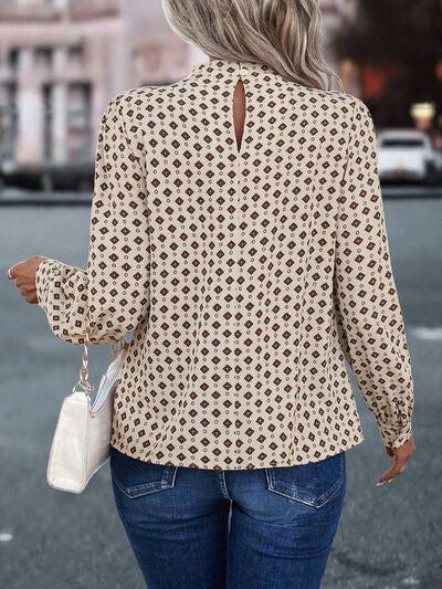 a woman walking down a street holding a purse