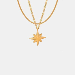 a gold necklace with a star on it