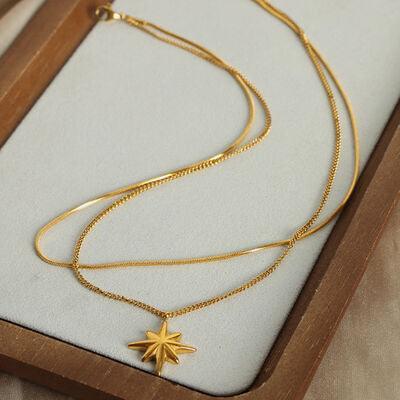 a necklace with a star on it in a wooden box