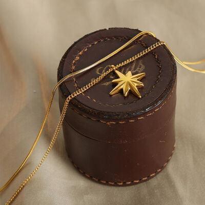 a small brown box with a gold star on it