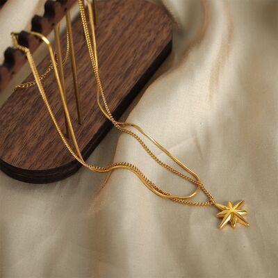 a gold necklace with a star on it