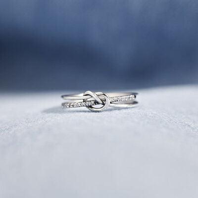 a close up of a ring on a white surface