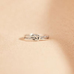 a close up of a ring with a knot on it