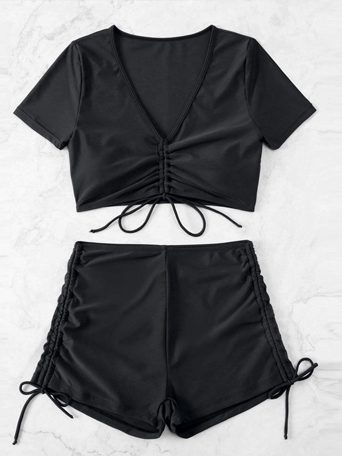 a women's black top and shorts set