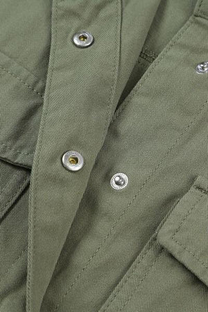 a close up of a green jacket with buttons