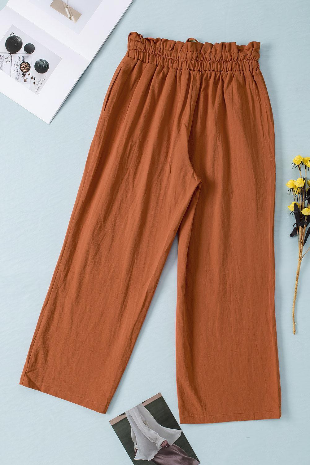 a pair of brown pants sitting on top of a table