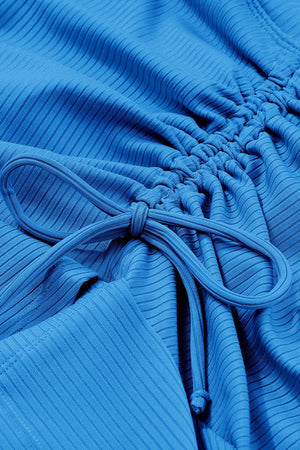 a close up of a blue cloth with a knot