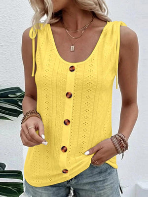 a woman wearing a yellow top and jeans