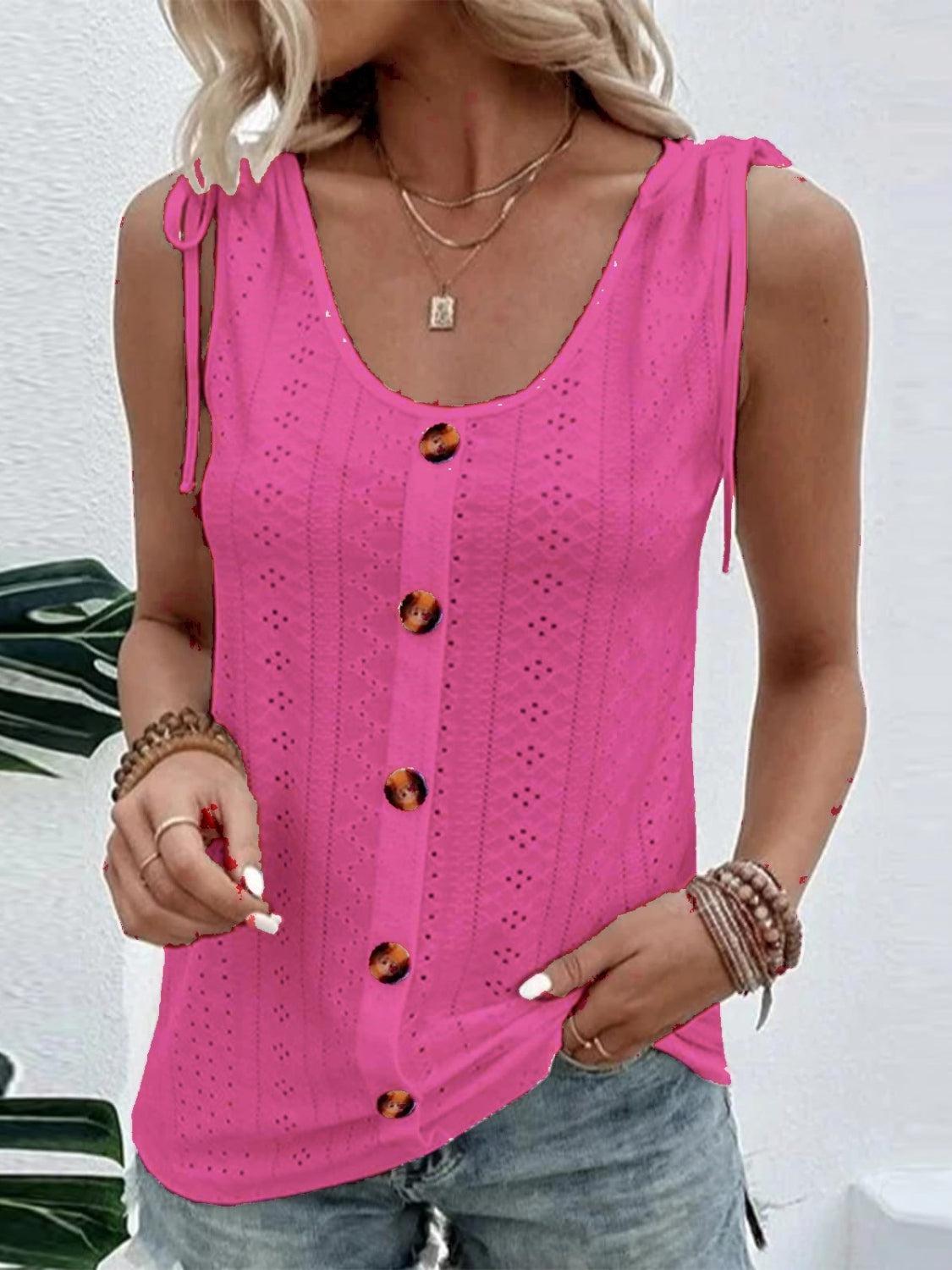 a woman wearing a pink top and jeans