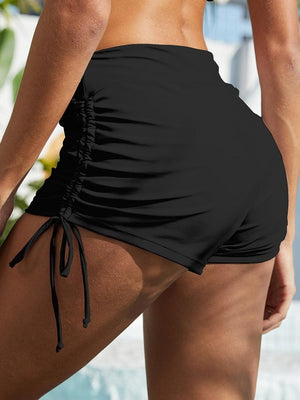 a close up of a person wearing a black swimsuit