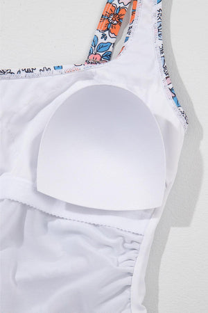 a close up of a white bra with a flower print on it