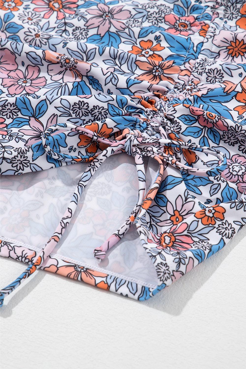 a close up of a flowered shirt on a white surface