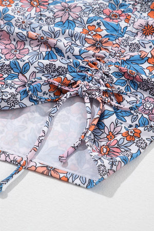 a close up of a flowered shirt on a white surface