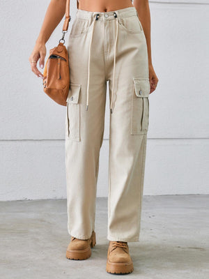 a woman in a crop top and cargo pants