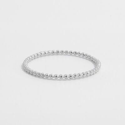 a silver beaded ring on a white background