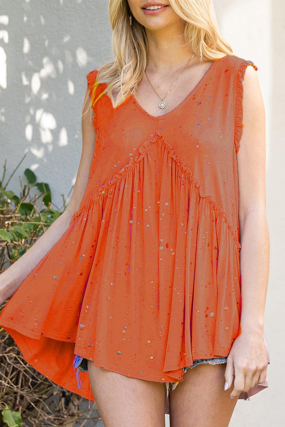 a woman in an orange dress posing for a picture