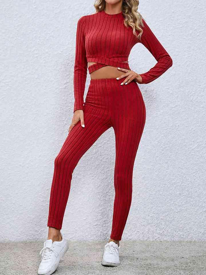 a woman wearing a red two piece set
