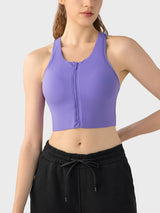 a woman wearing a purple sports bra top