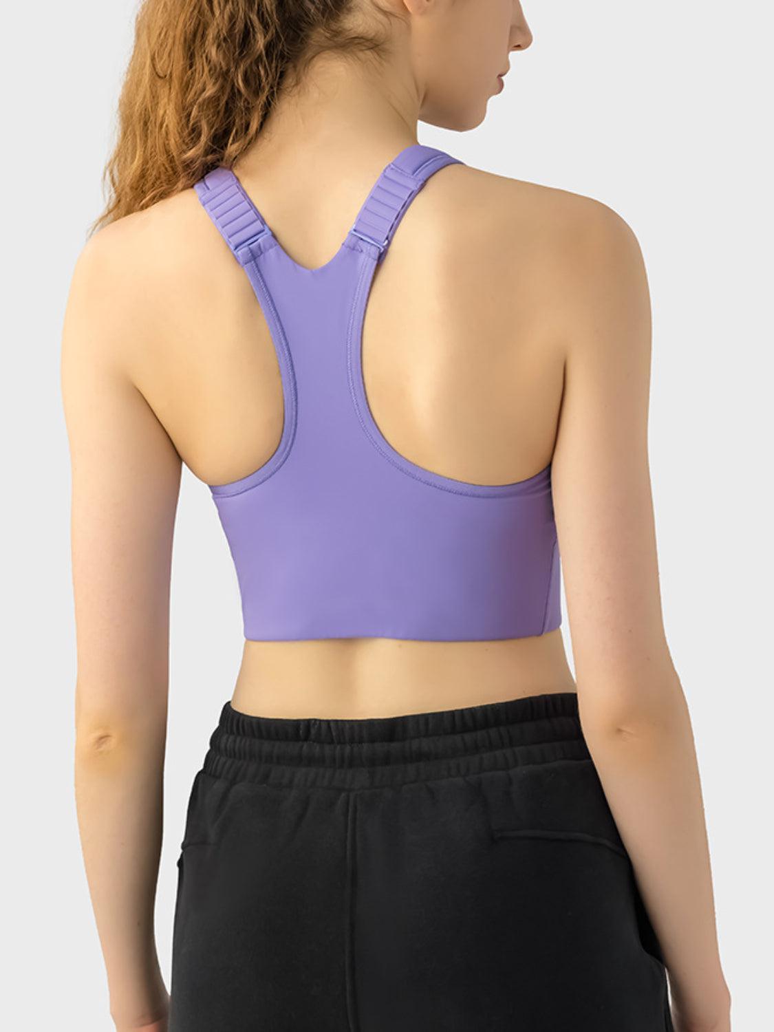 a woman wearing a purple sports bra top