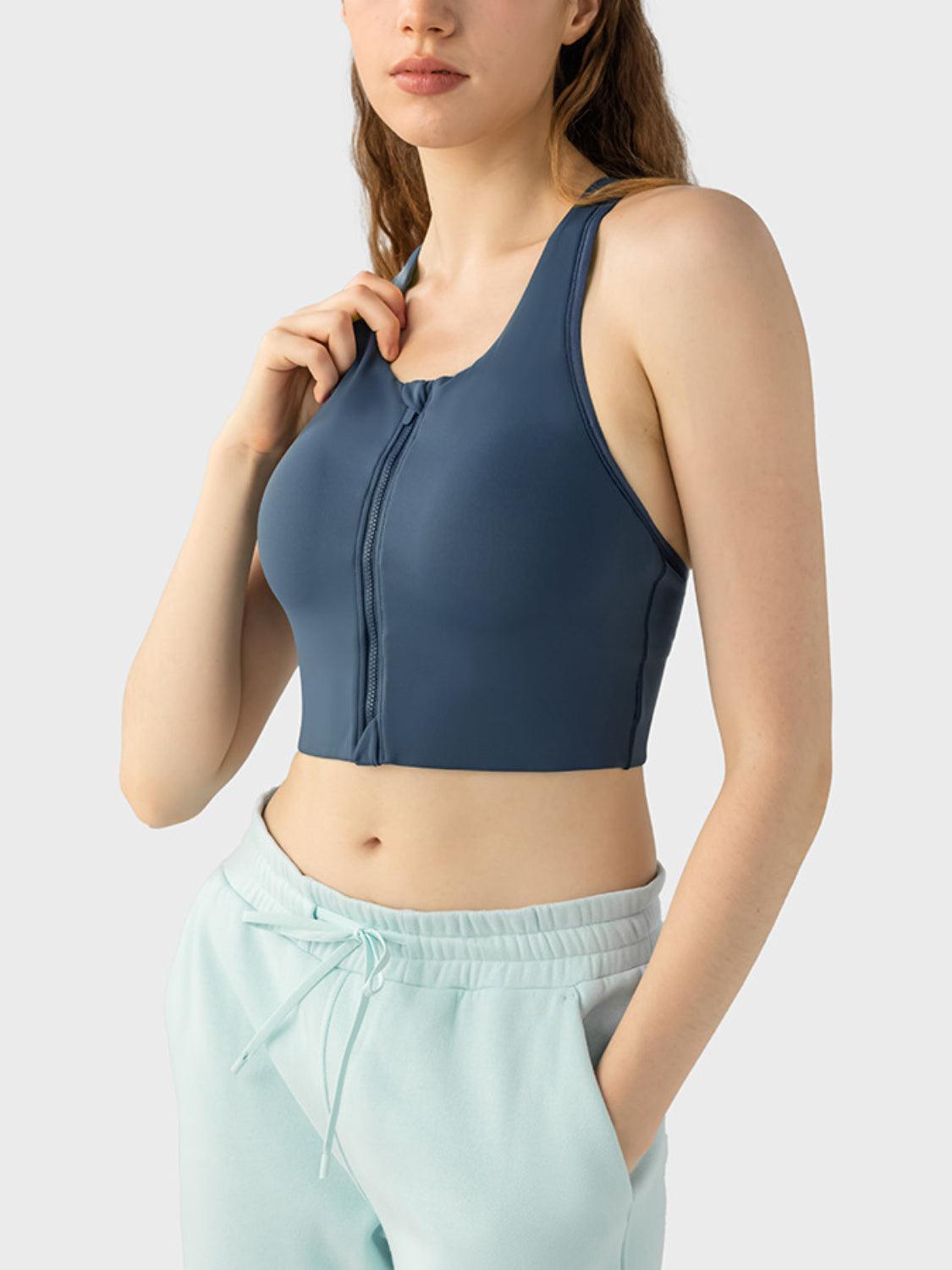 a woman wearing a blue sports bra top