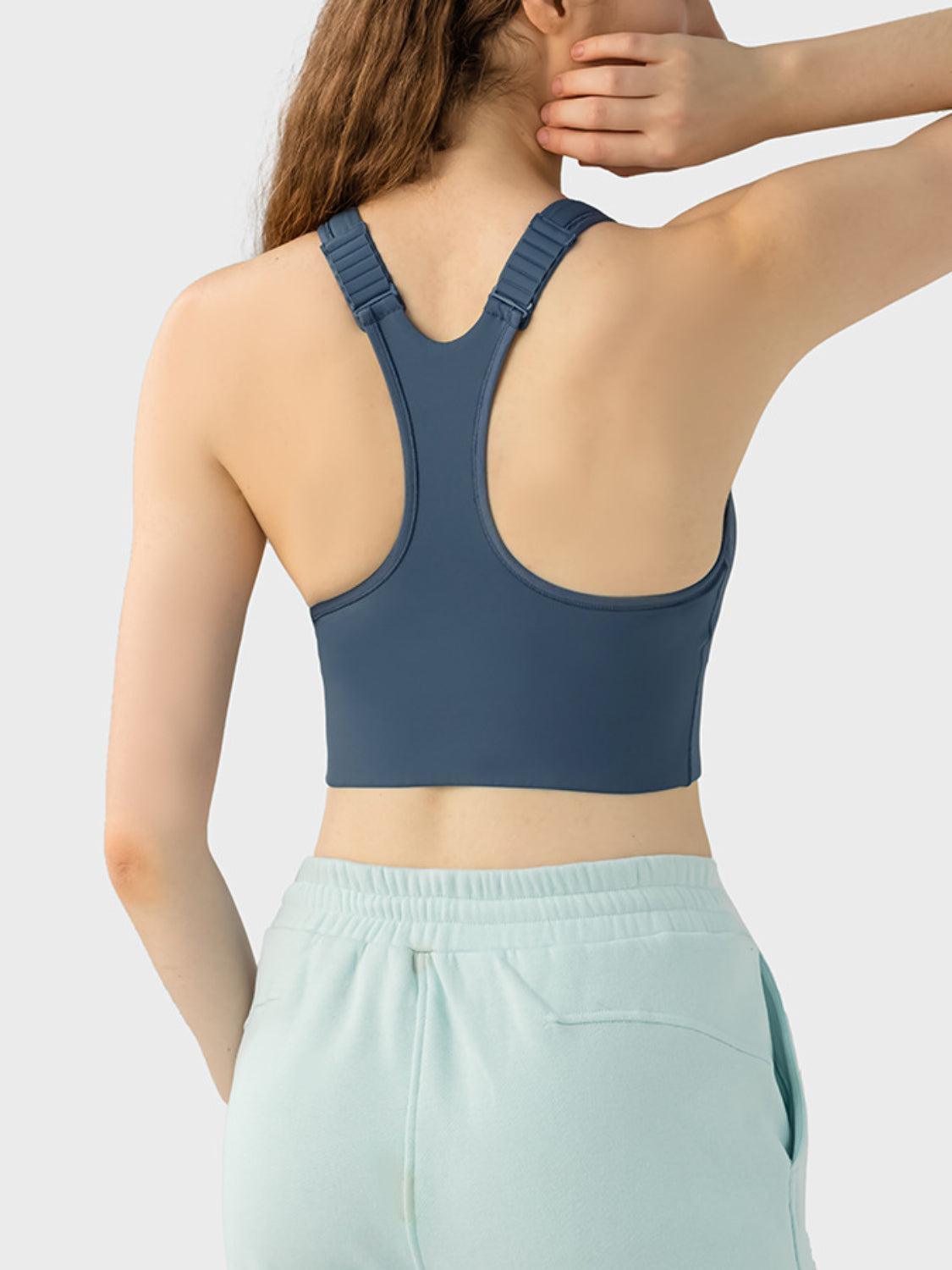 a woman wearing a blue sports bra top