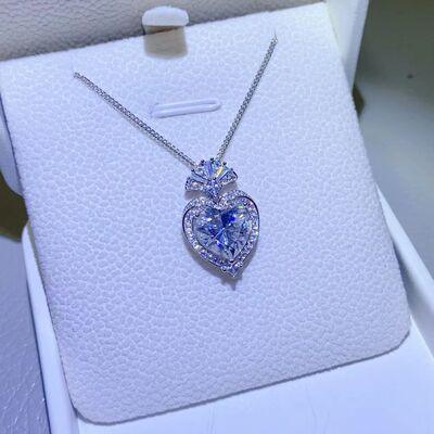 a heart shaped necklace in a white box