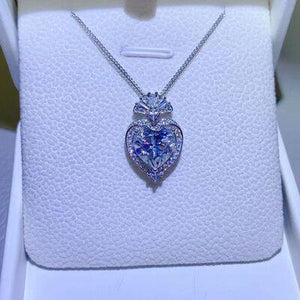 a heart shaped necklace in a box