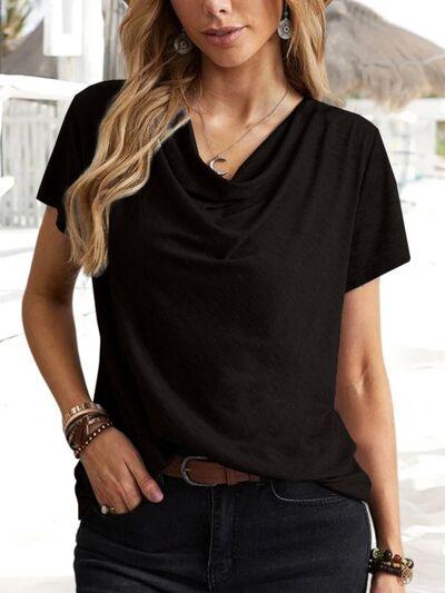 a woman wearing a black shirt and jeans