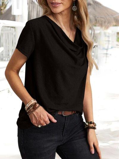 a woman wearing a black top and jeans