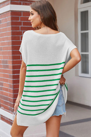 a woman wearing a white and green striped sweater