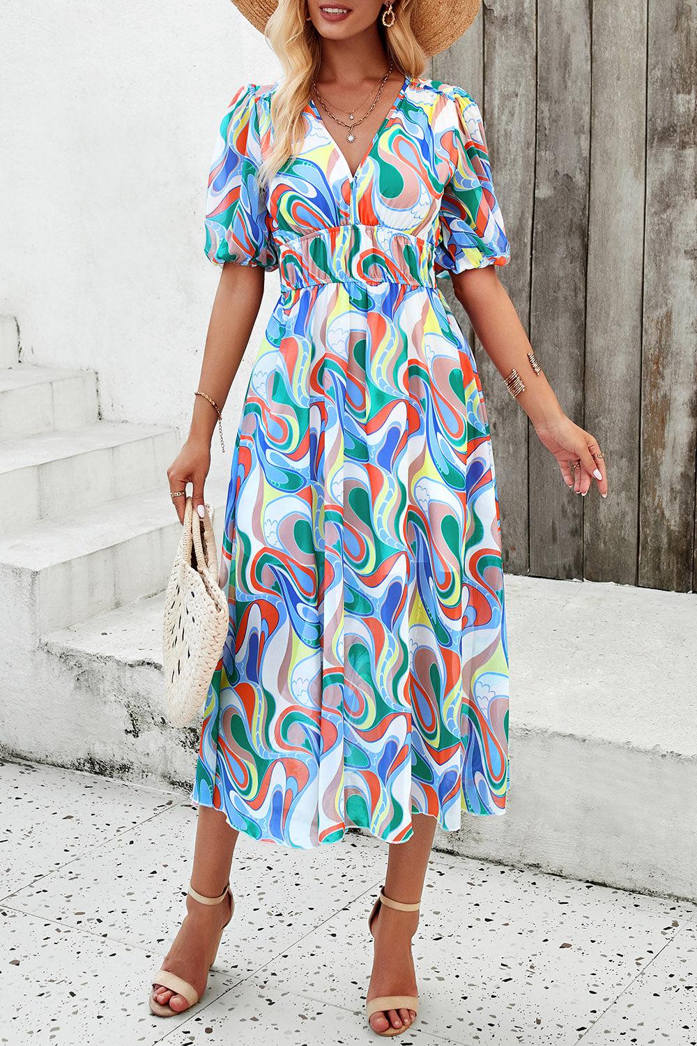 a woman in a colorful dress and straw hat