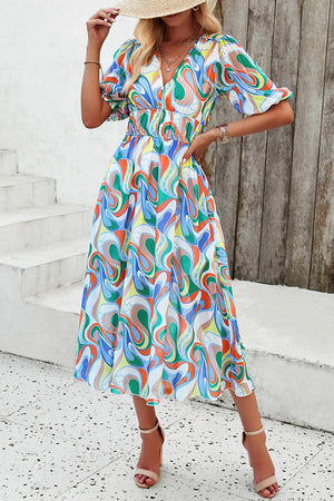 a woman in a colorful dress and straw hat