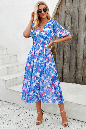 a woman wearing a blue and white dress