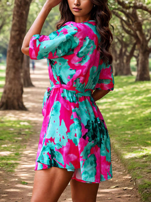 a woman in a colorful dress posing for a picture