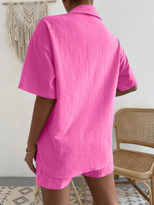 a woman wearing a pink shirt and shorts