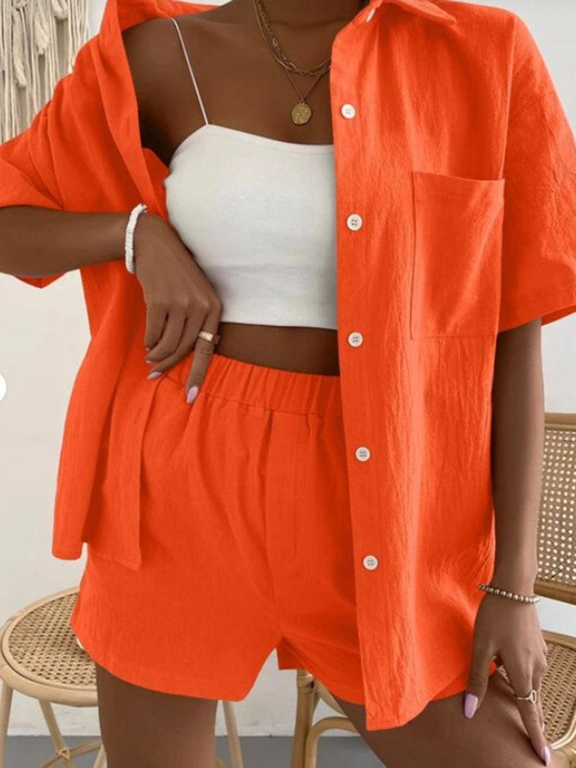 a woman wearing an orange shirt and shorts