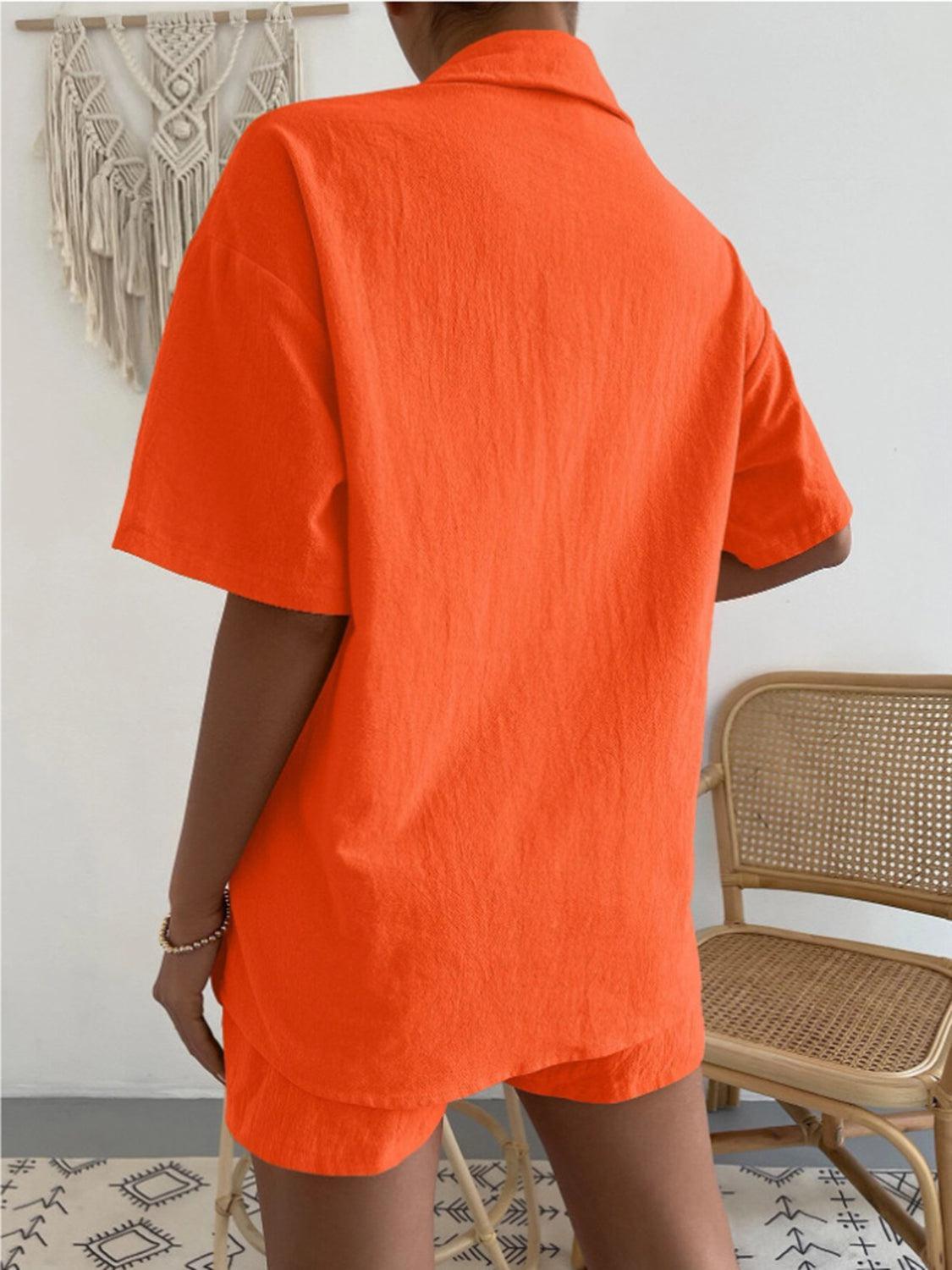 a woman wearing an orange shirt and shorts