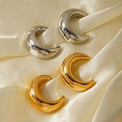 a pair of gold and silver hoop earrings