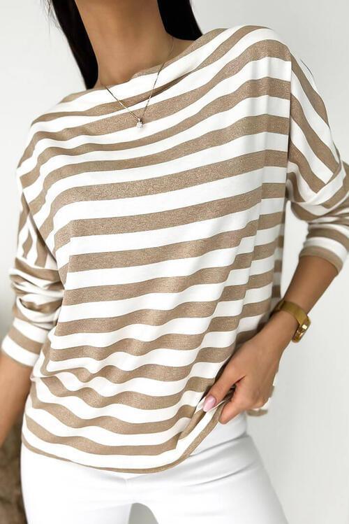 a woman wearing a brown and white striped shirt